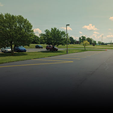 Routine pavement maintenance on a commercial lot